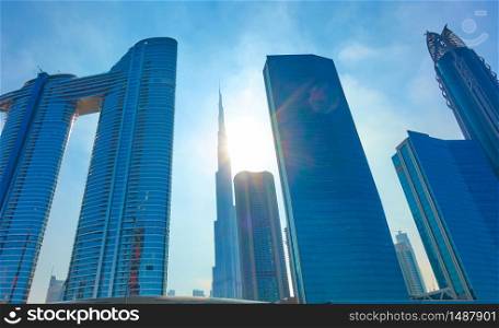 Modern skyscrapers of Dubai in the sunshine, UAE. Wide angle shot
