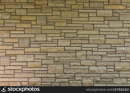 Modern stone wall of varying sizes of slabs