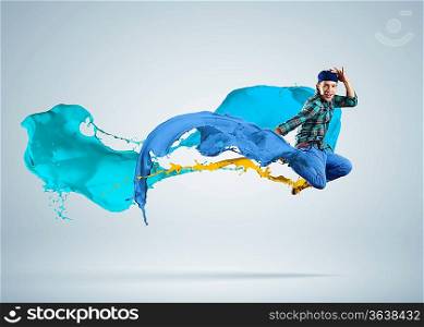 Modern style dancer jumping and paint splashes Illustration