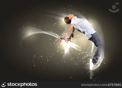 Modern style dancer. Modern style dancer posing against dark background with light effects. Illustration