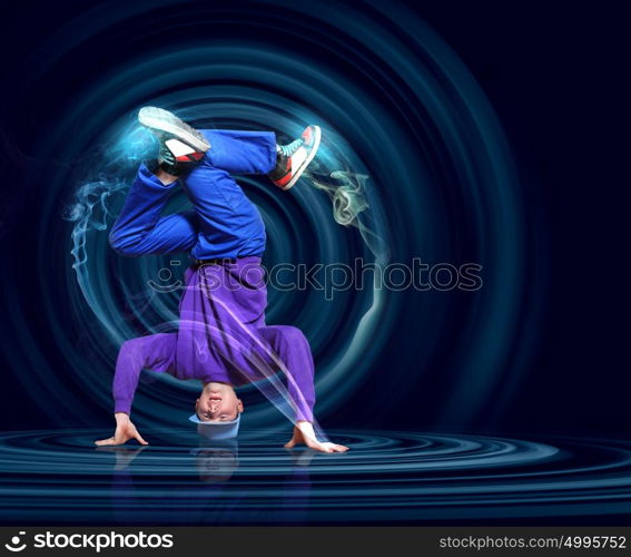 Modern style dancer. Modern style dancer posing against dark background with light effects. Illustration