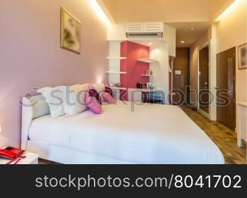 Modern style of bedroom with pink color tone in resort ,Thailand