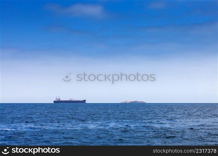 modern tanker and island in the ocean