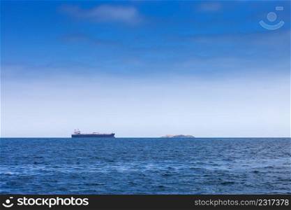 modern tanker and island in the ocean