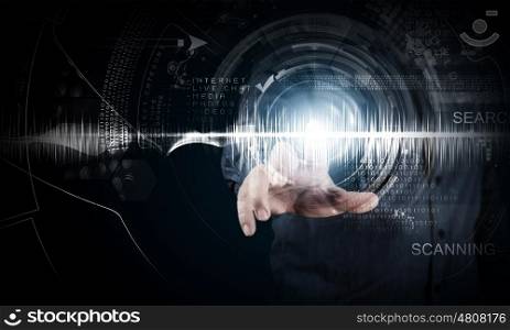 Modern technologies. Close up of businessman touching digital screen with finger