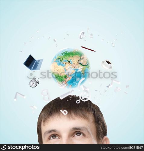 Modern technologies. Half of face of businessman with business items above head. Elements of this image are furnished by NASA