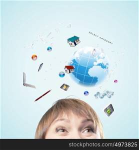 Modern technologies. Half of face of businesswoman with business items above head