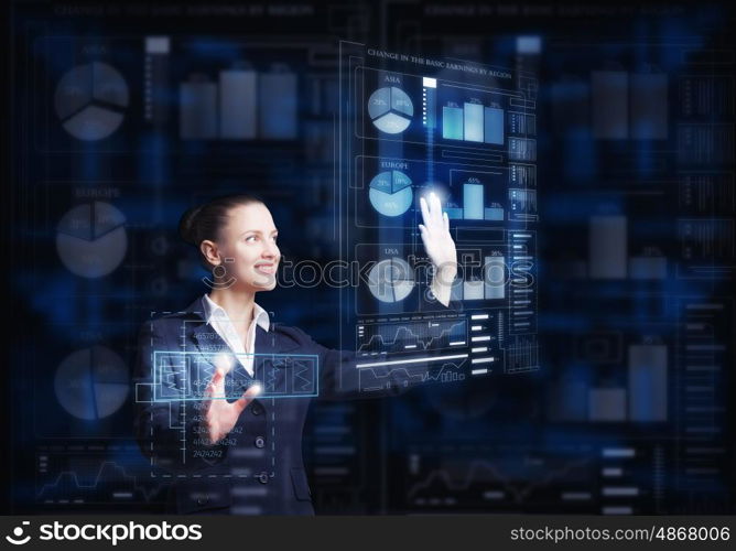 Modern technologies in use. Attractive smiling businesswoman working with virtual panel interface