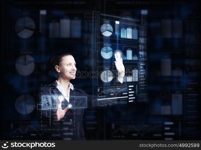 Modern technologies in use. Attractive smiling businesswoman working with virtual panel interface