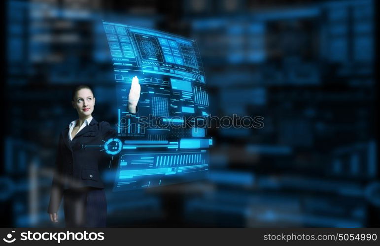 Modern technologies in use. Attractive smiling businesswoman working with virtual panel interface