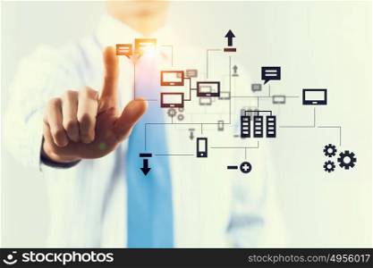 Modern technologies in use. Hand of businessman pushing with finger icon on media interface