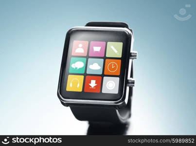 modern technology, application, object and media concept - close up of black smart watch with app icons on screen over blue background
