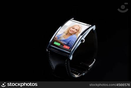 modern technology, communication, object and media concept - close up of black smart watch with incoming call on screen