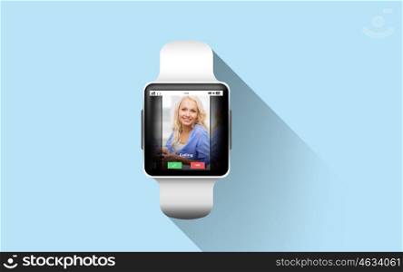modern technology, communication, object and media concept - close up of black smart watch with incoming call on screen over blue background