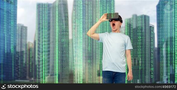 modern technology, entertainment, cyberspace and people concept - amazed young man with virtual reality headset or 3d glasses over city skyscrapers and binary code background. man in virtual reality headset or 3d glasses