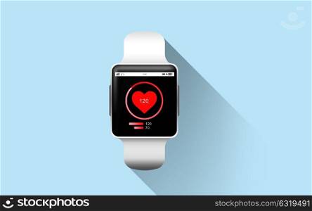 modern technology, health, object and media concept - close up of smart watch with heart rate icon on screen over blue background. close up of smart watch with heart rate icon