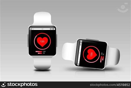 modern technology, health tracker, object, responsive design and media concept - smart watches with heart rate icon on screen over gray background