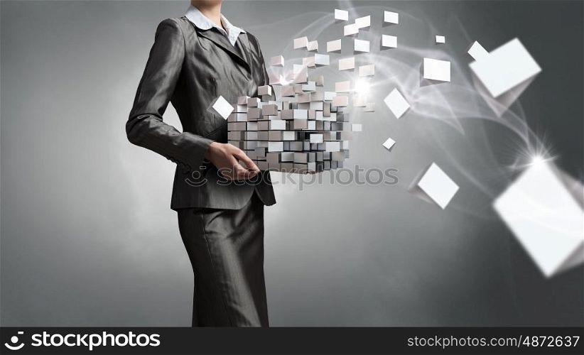 Modern technology integration concept. Close view of businesswoman shows cube as symbol of modern technology