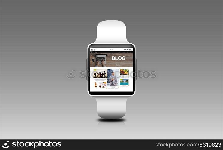 modern technology, internet, object and blogging concept - close up of black smart watch with blog web page on screen over gray background. close up of smart watch with blog page on screen