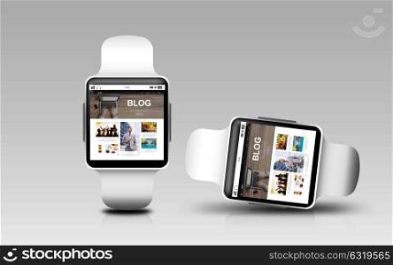 modern technology, internet, object, responsive design and blogging concept - smart watches with blog web page on screen over gray background. smart watches with blog page on screen