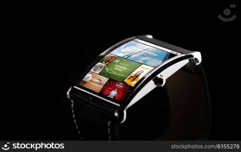 modern technology, mass media, object and media concept - close up of black smart watch with news application on screen