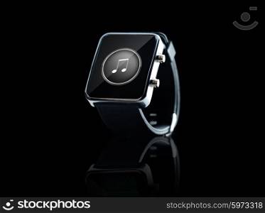 modern technology, media, object and media concept - close up of black smart watch with music note icon on screen over black background