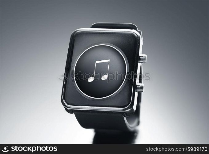 modern technology, media, object and media concept - close up of black smart watch with music note icon on screen over gray background
