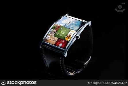 modern technology, object and media concept - close up of black smart watch with internet news on screen