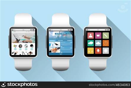 modern technology, object and media concept - close up of black smart watches with applications on screen over blue background