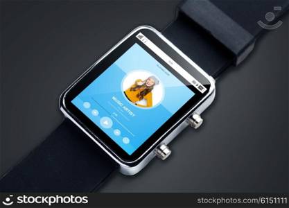modern technology, object and media concept - close up of smart watch with media player music track on screen