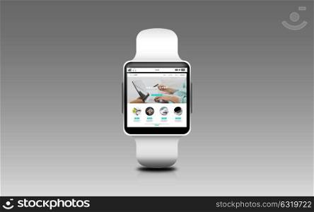 modern technology, object and shopping online concept - close up of smart watch with internet shop web page screen over gray background. close up of smart watch with online shop on screen