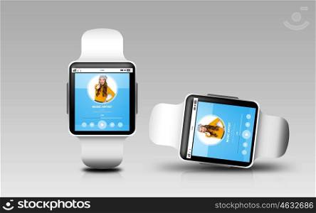modern technology, object, responsive design and media concept - smart watches with music player application on screen over gray background