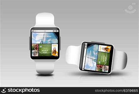 modern technology, responsive design, object and media concept - smart watches with internet news application on screen over gray background. smart watches with internet news on screen