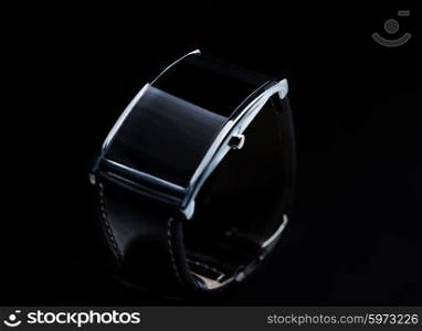 modern technology, time, object and media concept - close up of black smart watch
