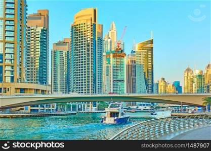 Modern towers of Dubai Marina and waterfront in the evening, United Arab Emirates
