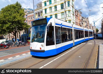 Modern tram in Amsterdam. Amsterdam is the capital and most populous city of the Netherlands