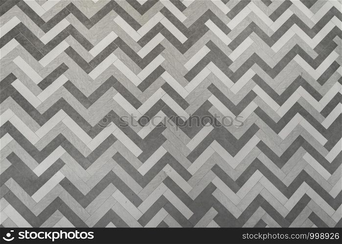 Modern white and grey concrete cement tiles on wall or flooring pattern surface texture. Close-up of exterior material for design decoration background