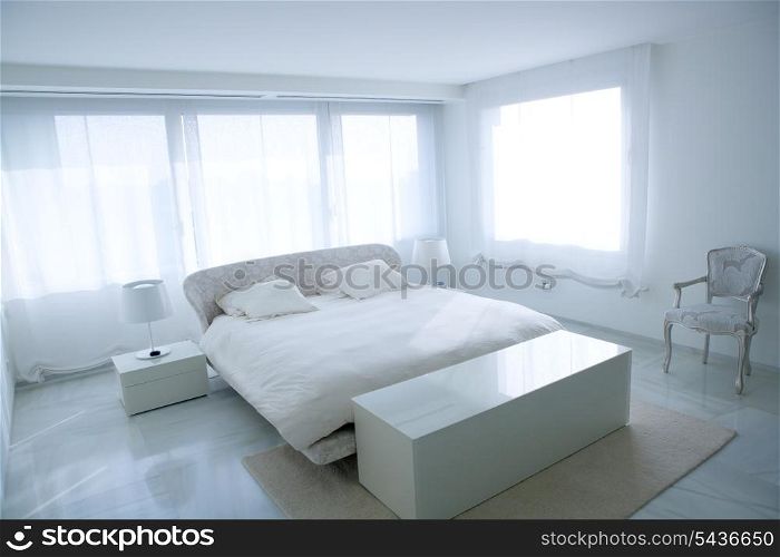 Modern white house bedroom with marble floor and luminous windows