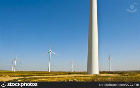 Modern Wind Turbines Producing Energy In Spain