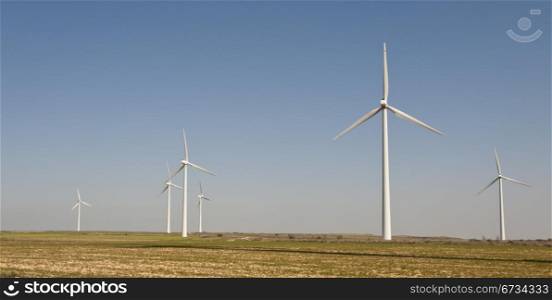 Modern Wind Turbines Producing Energy In Spain