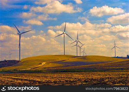 Modern Wind Turbines Producing Energy in Spain at Sunset, Vintage Style Toned Picture