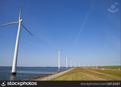 Modern windmills at Dutch dike