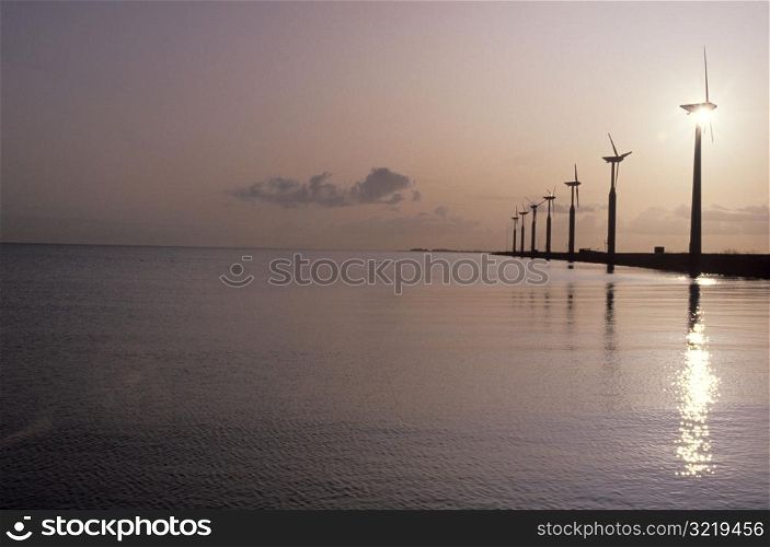 Modern Windmills by the Ocean