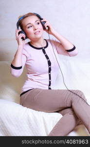 Modern woman with headphones listening to music