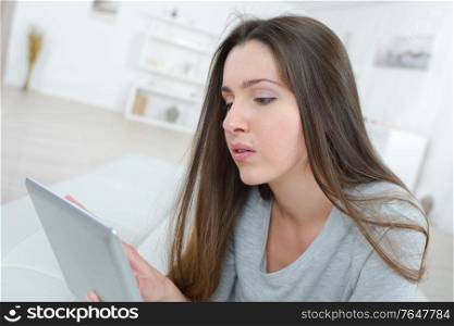 modern woman with tablet in the living room