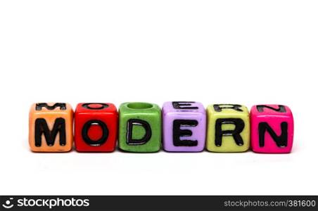 modern - word made from multicolored child toy cubes with letters
