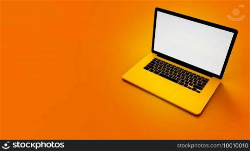 Modern yellow laptop  isolated on orange background. 