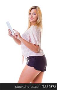 Modern young woman using tablet touchpad. Blond girl reading e-book e-reader isolated. Technology.