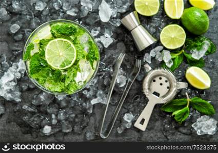 Mojito cocktail ingredients lime, mint leaves, ice. Drink making accessories