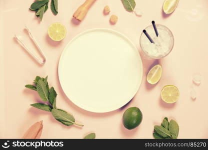 Mojito cocktail ingredients on pink background